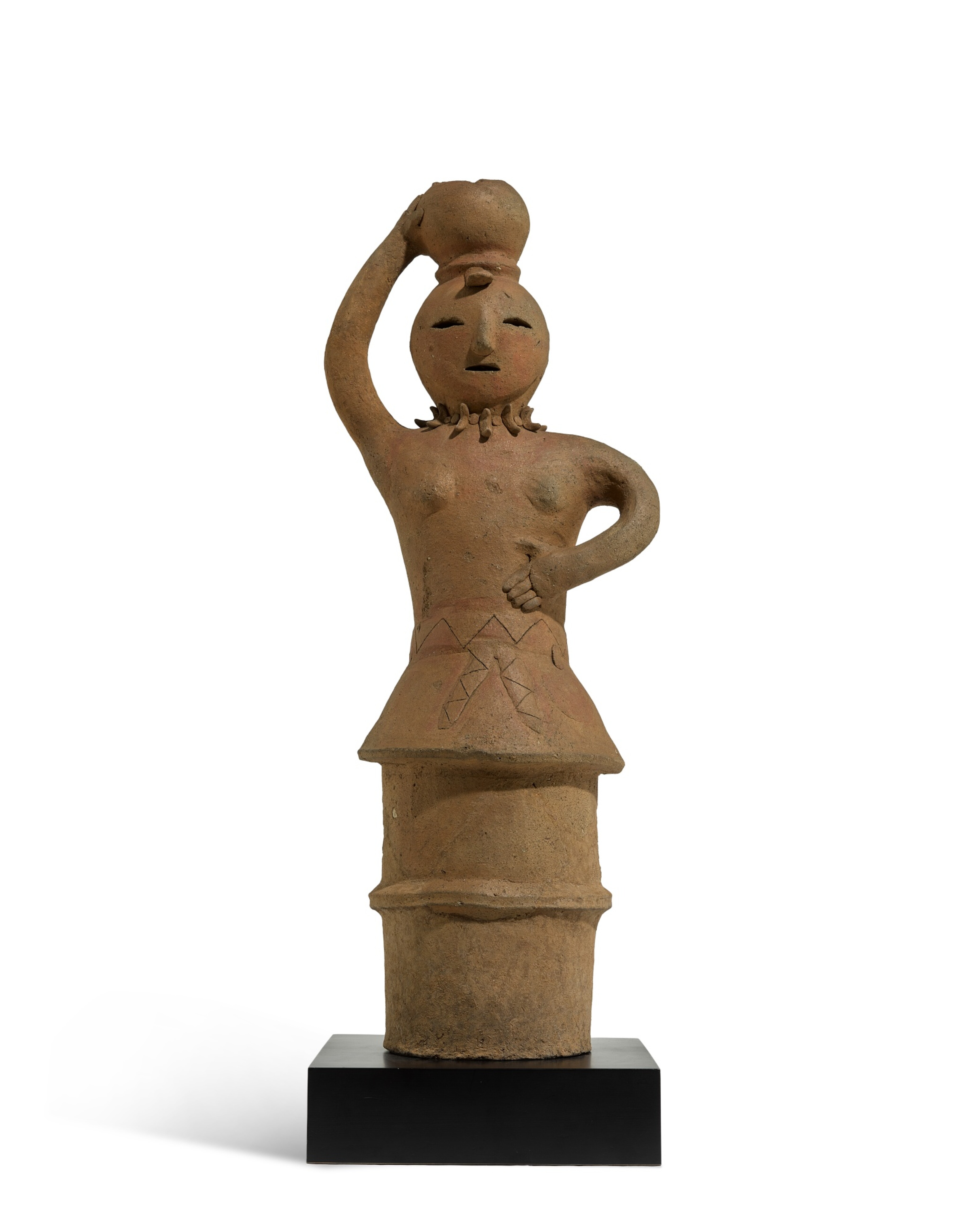 A Haniwa earthenware figure of a woman, Late Kofun period, 5th – 6th century